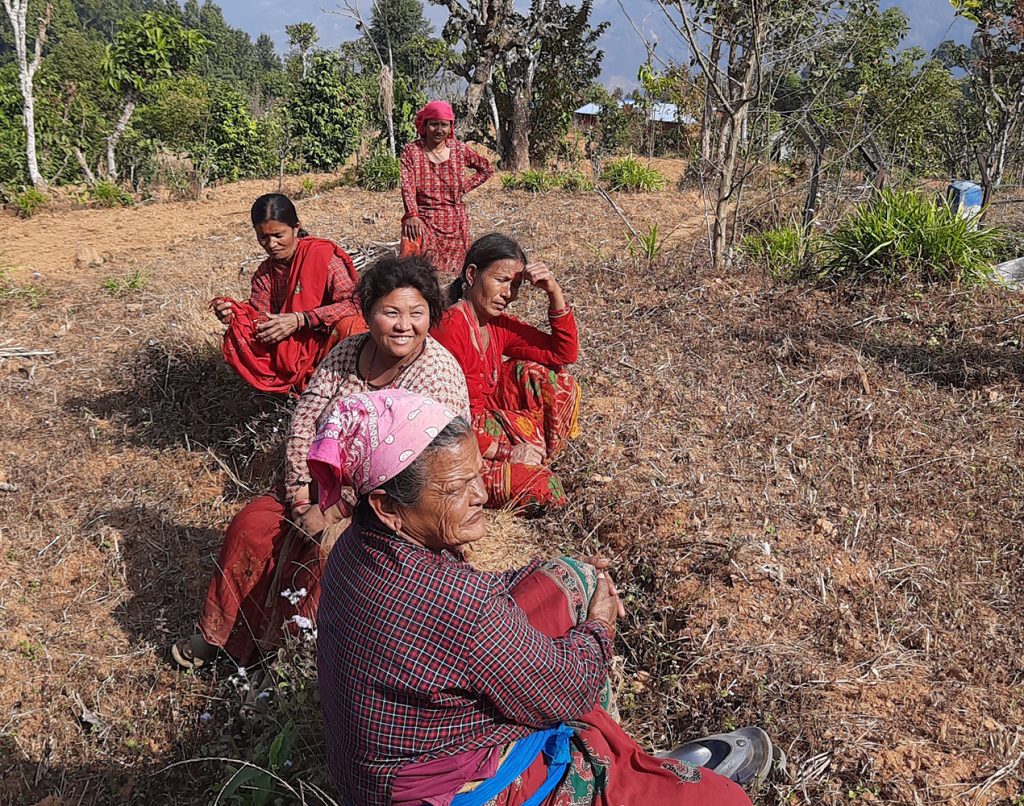 Women's group meeting in a field in Nepal