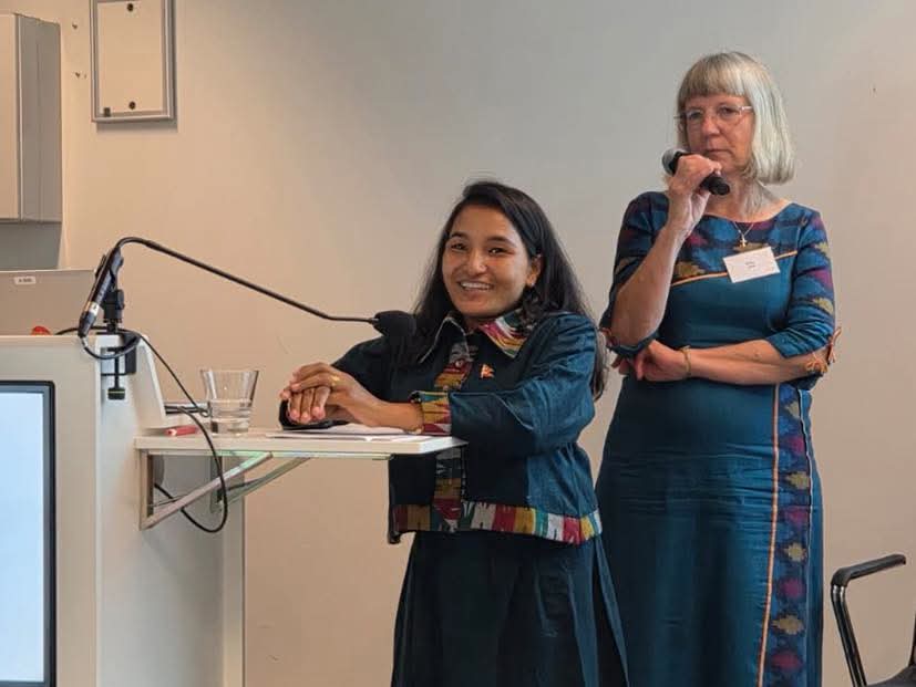 Sabina Parajuli speaking in Felm's annual meeting in Finland. Behind, Felm's ex-employee Elina Lind. Photo: Felm